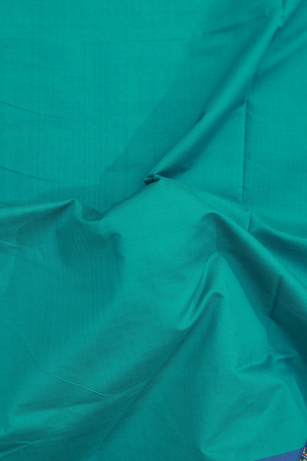 Semi Silk Cotton Saree In Peacock Blue With Zari Border