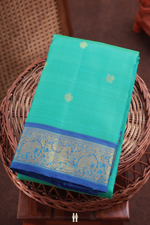 Kanchipuram Silk Saree In Greenish Blue With Peacock Buttas