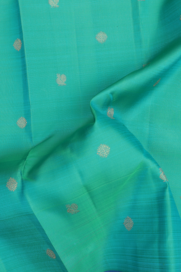 Kanchipuram Silk Saree In Greenish Blue With Peacock Buttas