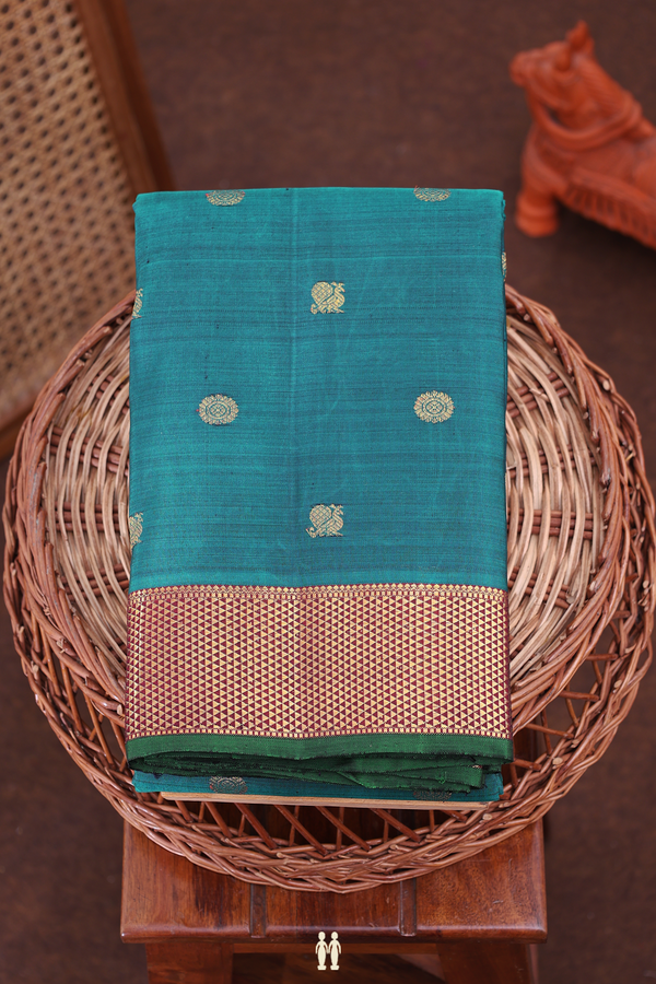 Kanchipuram Silk Saree In Pine Green With Peacock Buttas