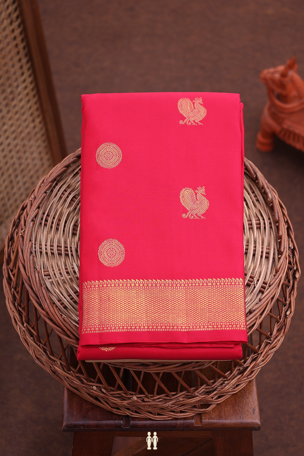 Kanchipuram Silk Saree In Crimson Red With Peacock Buttas