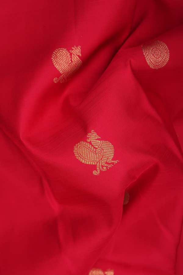 Kanchipuram Silk Saree In Crimson Red With Peacock Buttas