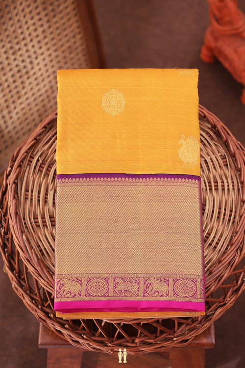 Kanchipuram Silk Saree In Mustard Yellow With Peacock Buttas