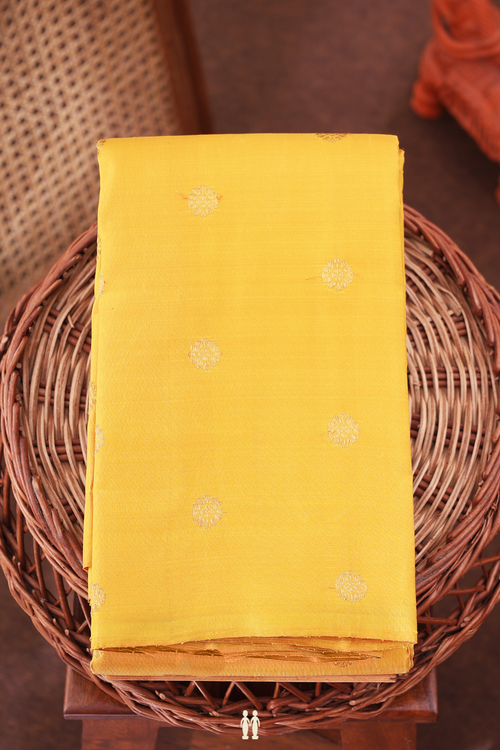 Kanchipuram Silk Saree In Saffron Yellow With Floral Buttas