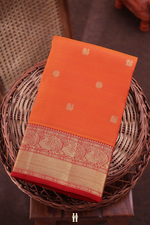 Kanchipuram Silk Saree In Bright Orange With Peacock Buttas