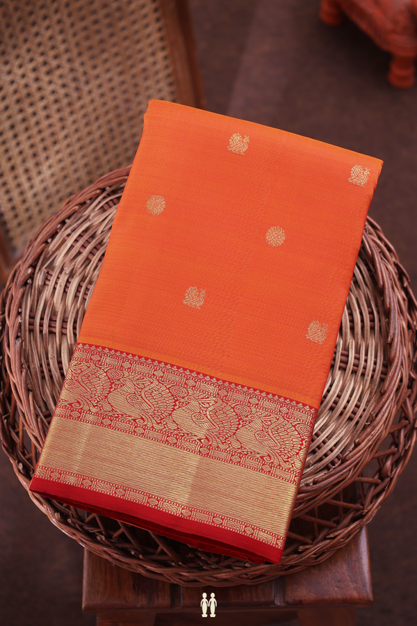 Kanchipuram Silk Saree In Bright Orange With Peacock Buttas