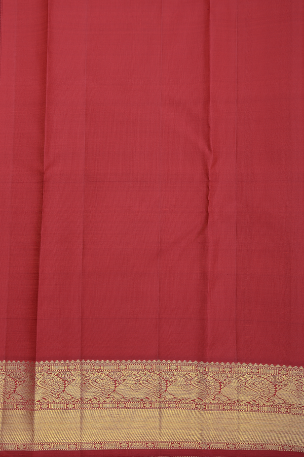 Kanchipuram Silk Saree In Bright Orange With Peacock Buttas