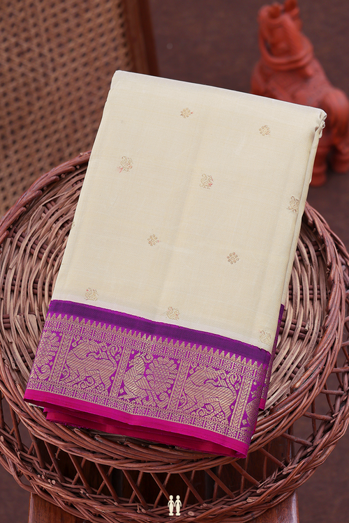 Kanchipuram Silk Saree In Cream Color With Peacock Buttas