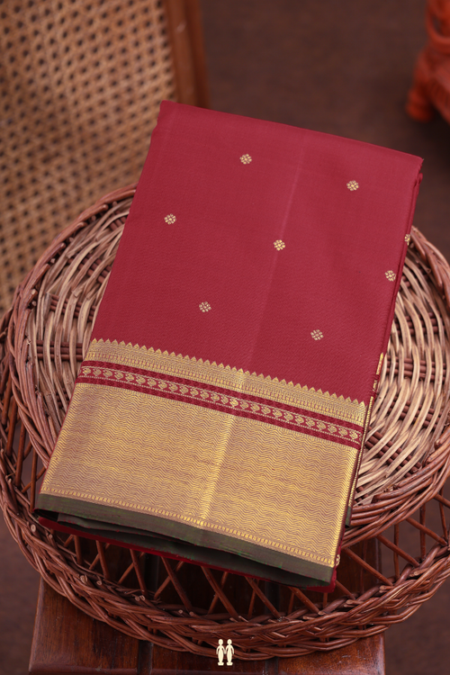 Kanchipuram Silk Saree In Crimson Red With Floral Buttis