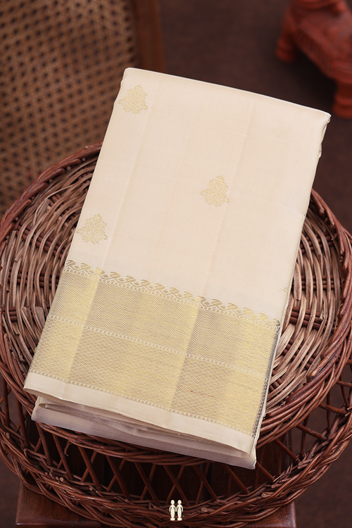 Kanchipuram Silk Saree In Cream Color With Peacock Buttas