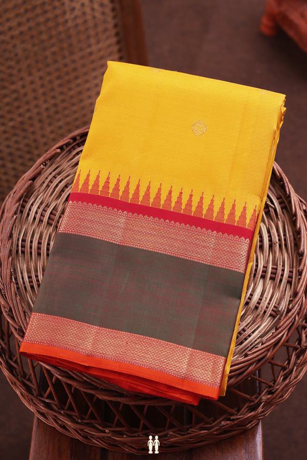 Kanchipuram Silk Saree In Saffron Yellow With Zari Buttas