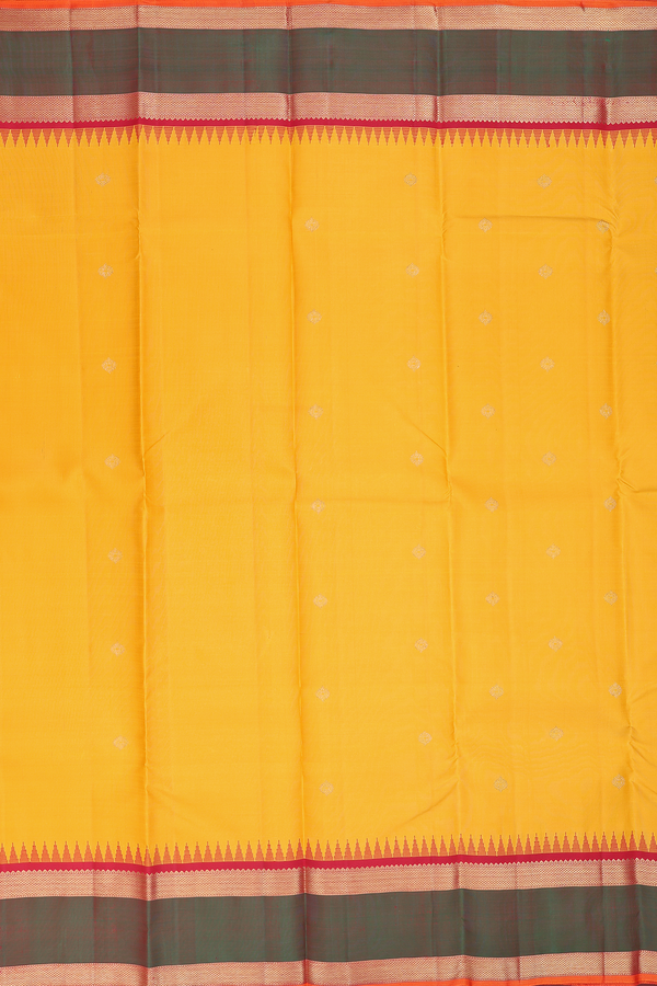 Kanchipuram Silk Saree In Saffron Yellow With Zari Buttas
