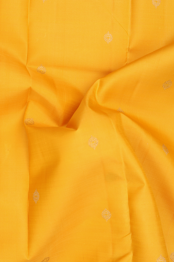 Kanchipuram Silk Saree In Saffron Yellow With Zari Buttas
