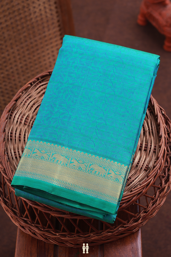 Kanchipuram Silk Saree In Bluish Green With Floral Design