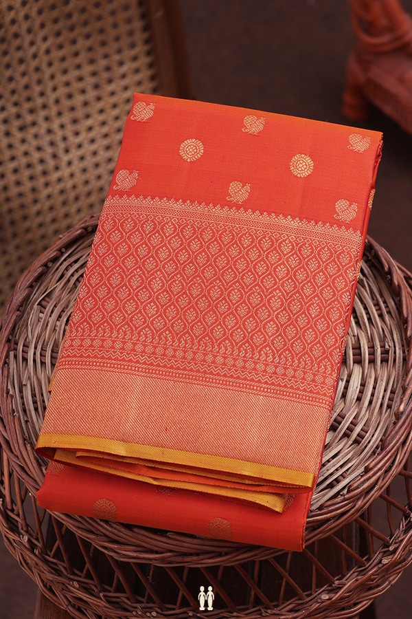 Kanchipuram Silk Saree In Orange With Peacock Buttas