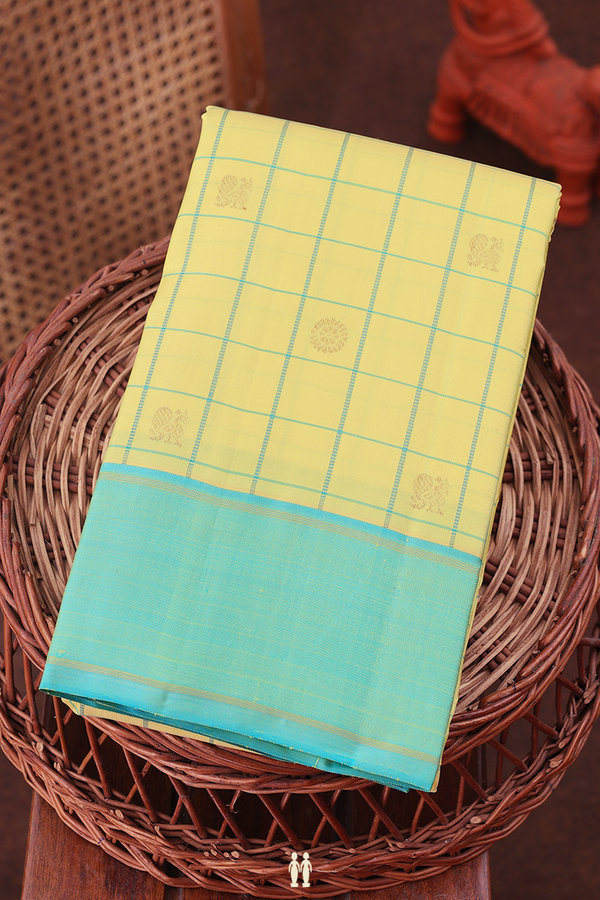 Kanchipuram Silk Saree In Light Yellow With Checks Design