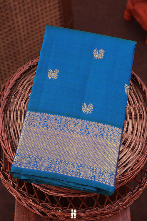 Kanchipuram Silk Saree In Cerulean Blue With Peacock Buttas