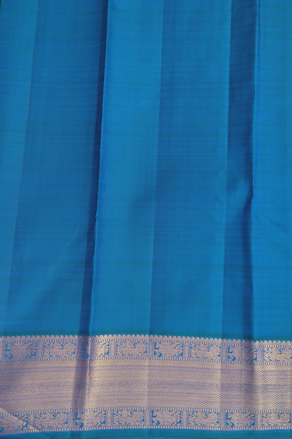 Kanchipuram Silk Saree In Cerulean Blue With Peacock Buttas