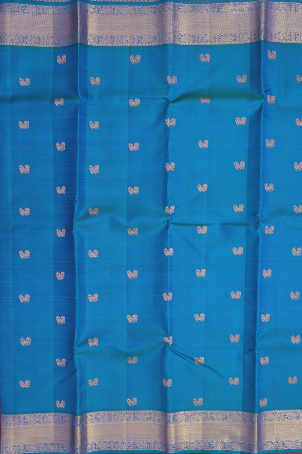 Kanchipuram Silk Saree In Cerulean Blue With Peacock Buttas