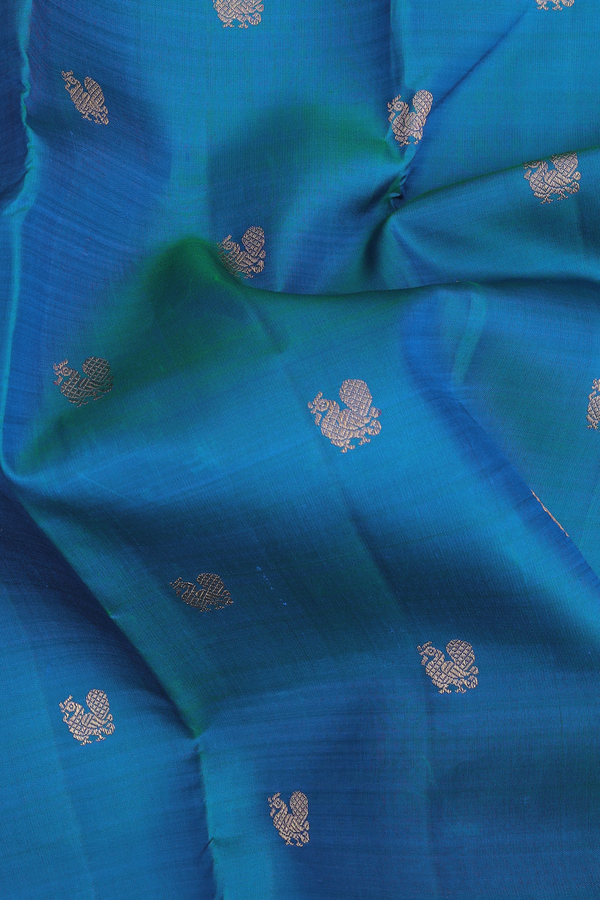 Kanchipuram Silk Saree In Cerulean Blue With Peacock Buttas