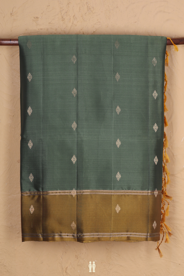 Soft Silk Saree In Green With Zari Buttas