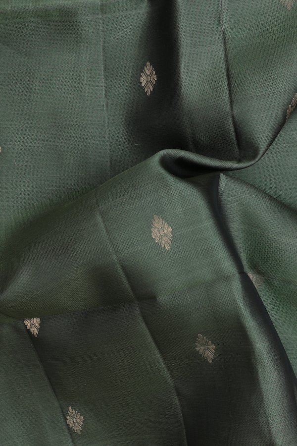 Soft Silk Saree In Green With Zari Buttas