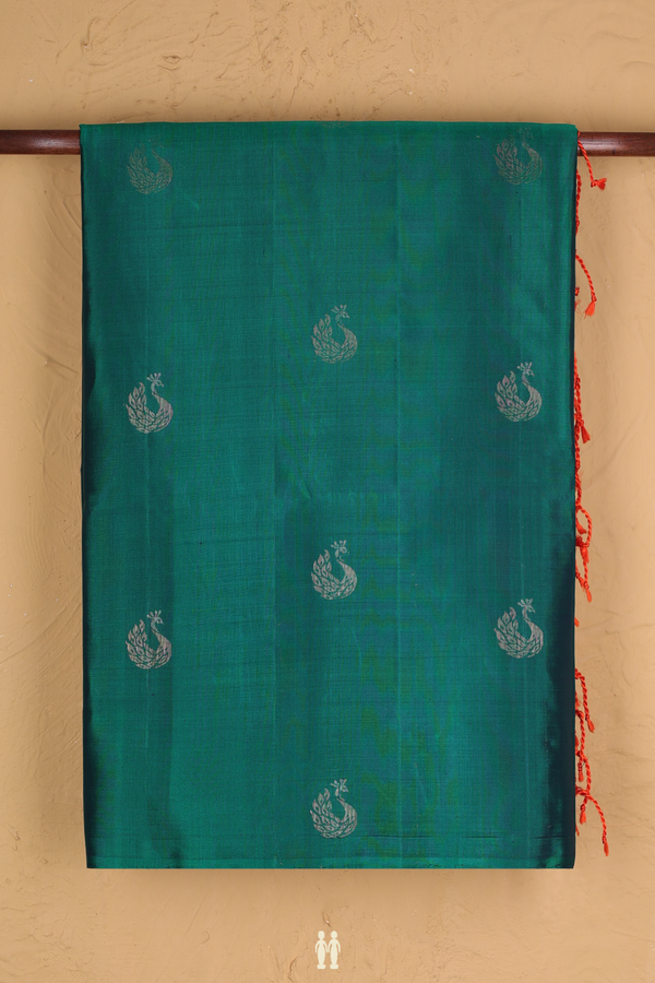 Soft Silk Saree In Teal Green With Peacock Buttas