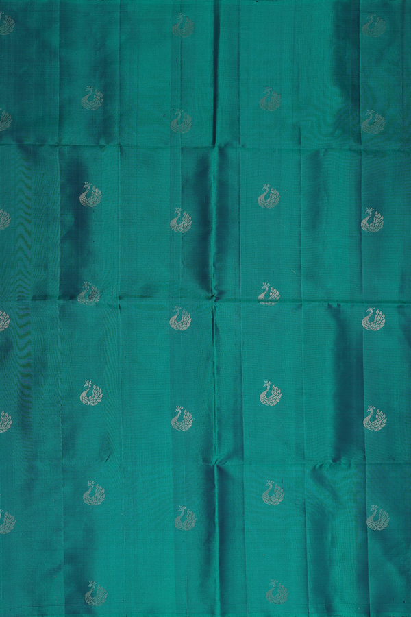 Soft Silk Saree In Teal Green With Peacock Buttas