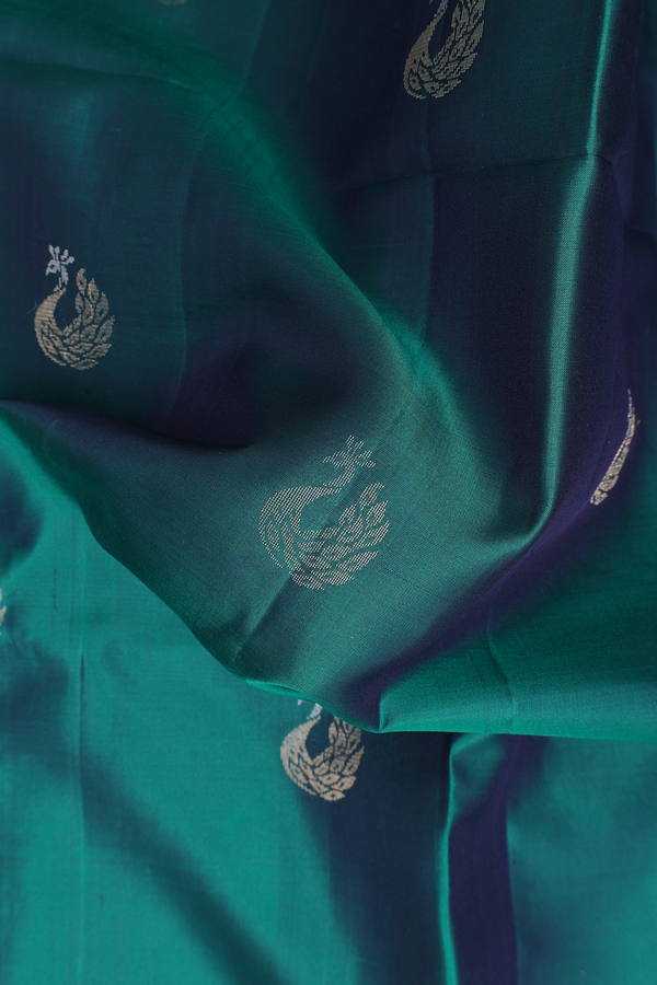 Soft Silk Saree In Teal Green With Peacock Buttas
