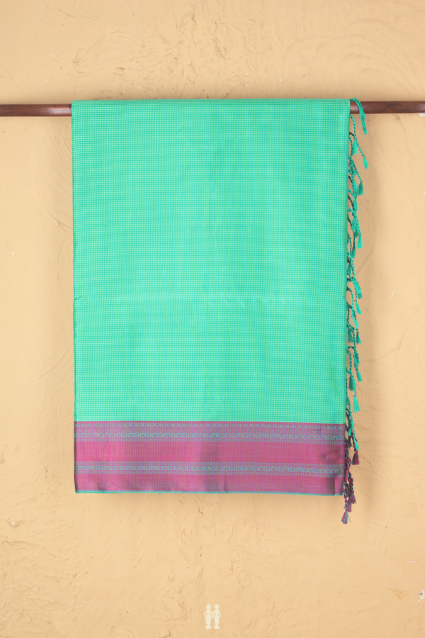 Soft Silk Saree In Shades Of Green With Checks Design