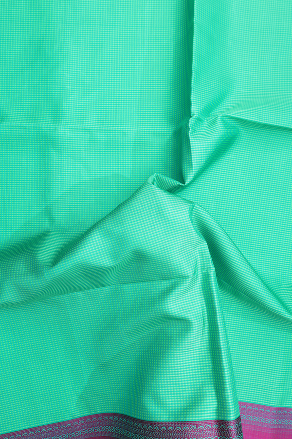 Soft Silk Saree In Shades Of Green With Checks Design