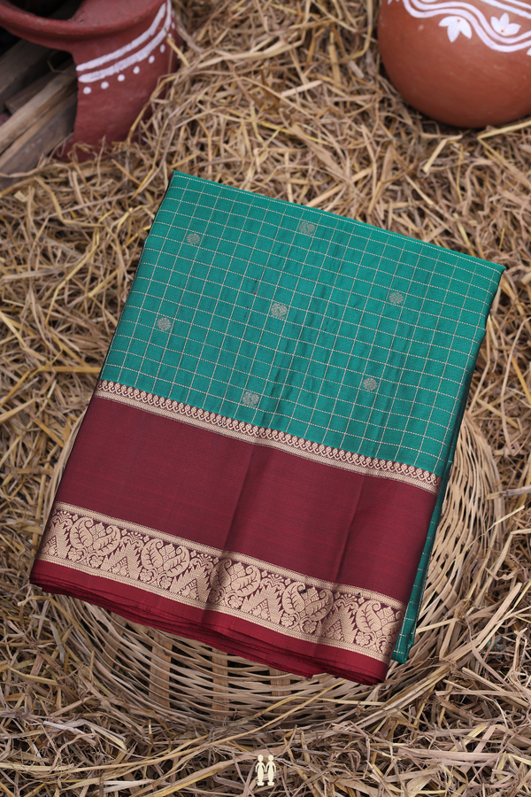 Soft Silk Saree In Peacock Green With Checks Design