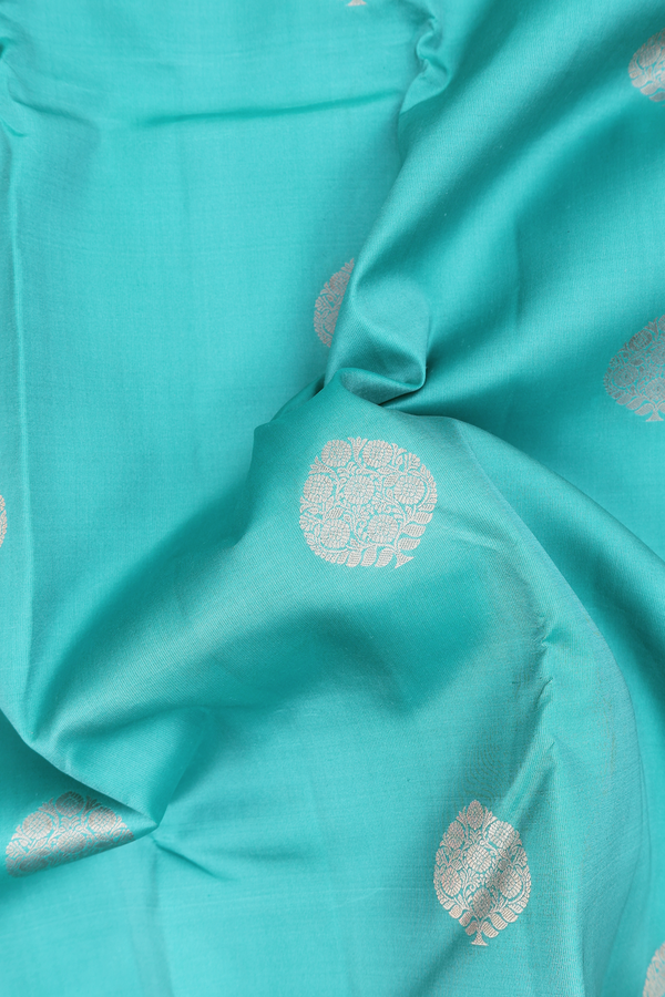 Kanchipuram Silk Saree In Turkish Blue With Tree Buttas