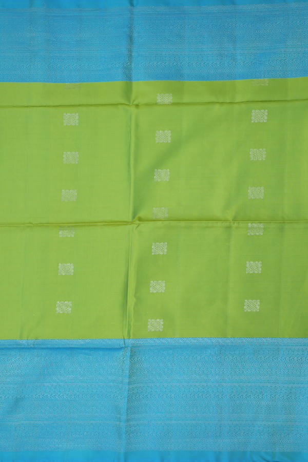 Soft Silk Saree In Parrot Green With Zari Buttas