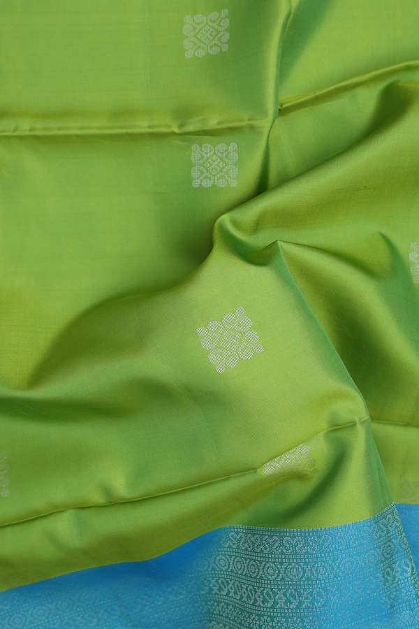 Soft Silk Saree In Parrot Green With Zari Buttas