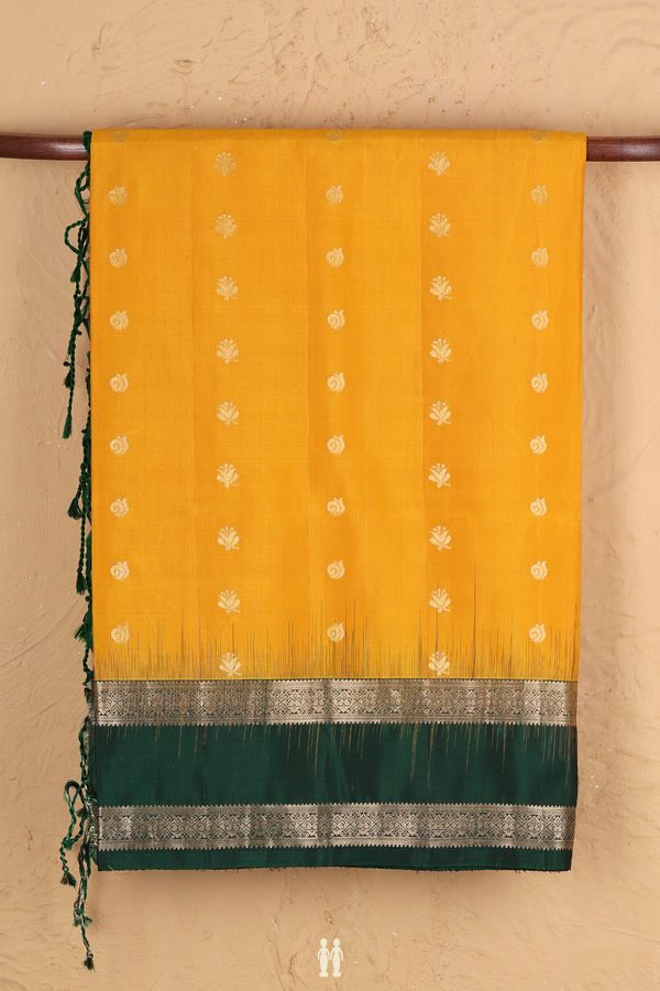 Soft Silk Saree In Saffron Yellow With Floral Buttas