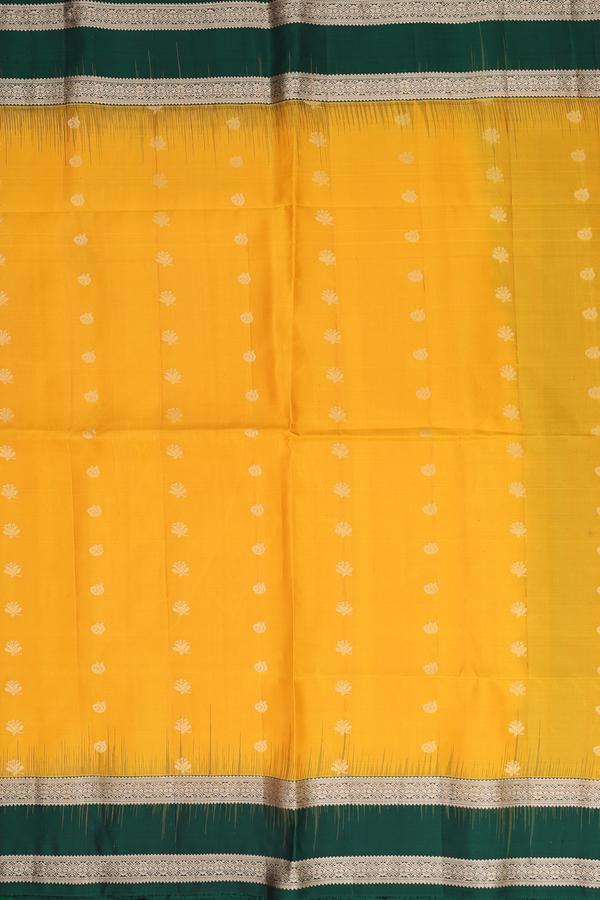 Soft Silk Saree In Saffron Yellow With Floral Buttas
