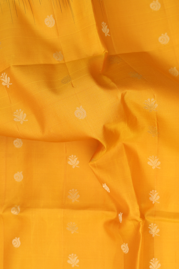 Soft Silk Saree In Saffron Yellow With Floral Buttas