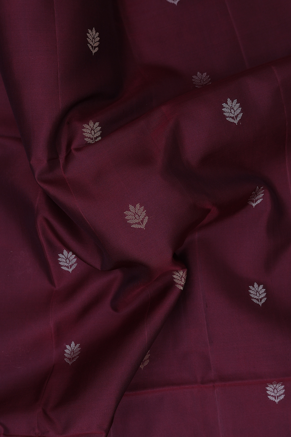 Soft Silk Saree In Maroon With Floral Buttas
