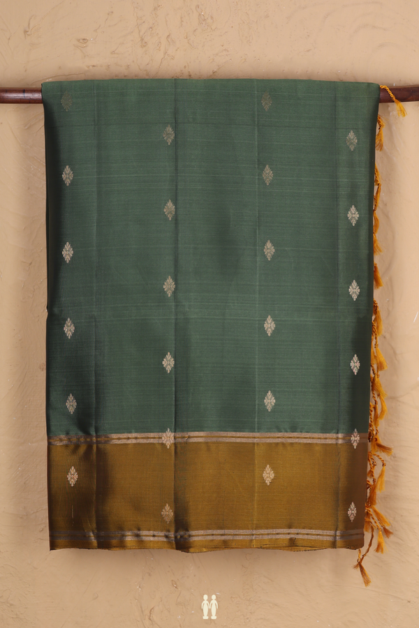 Soft Silk Saree In Green With Zari Buttas