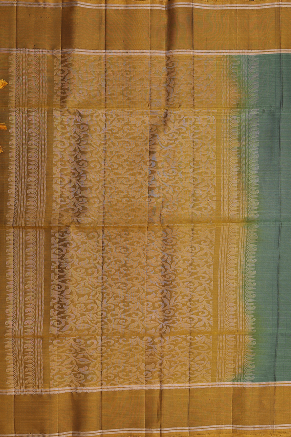 Soft Silk Saree In Green With Zari Buttas