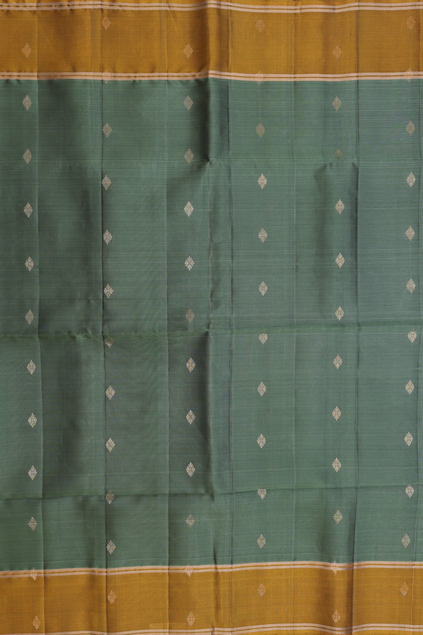 Soft Silk Saree In Green With Zari Buttas