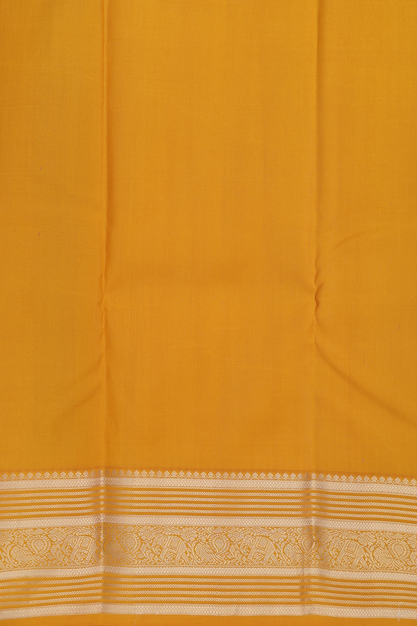Kanchipuram Silk Saree In Regal Purple With Paisley Buttas