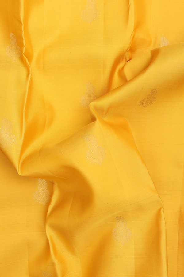 Kanchipuram Silk Saree In Yellow With Paisley Buttas