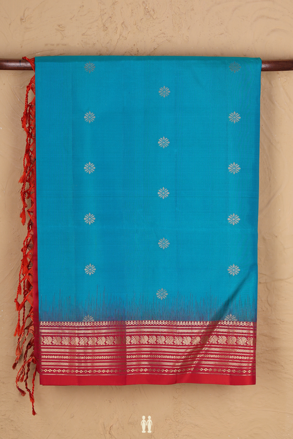 Soft Silk Saree In Peacock Blue With Floral Buttas