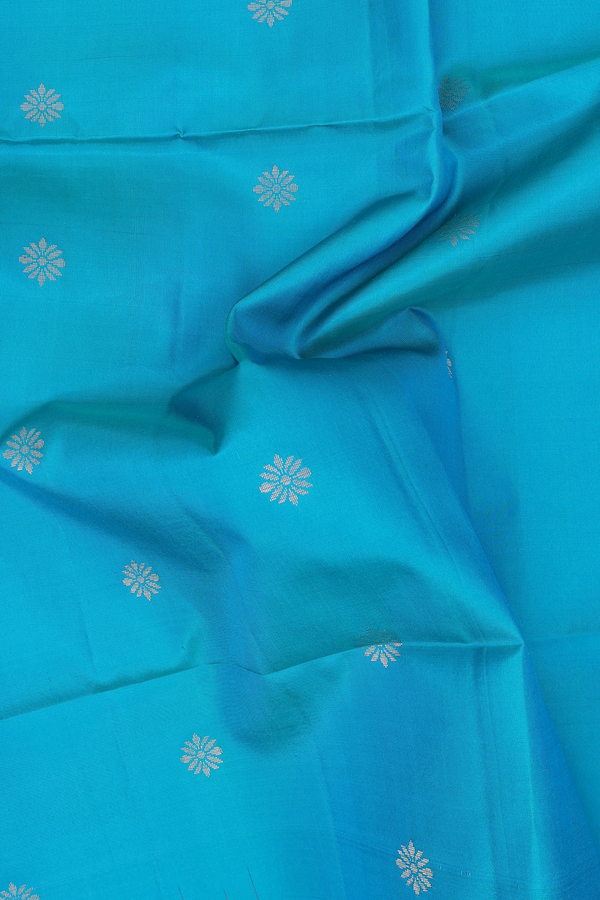 Soft Silk Saree In Peacock Blue With Floral Buttas