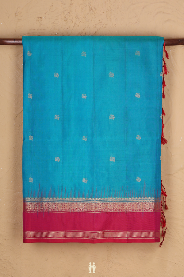 Soft Silk Saree In Blue With Floral Buttas