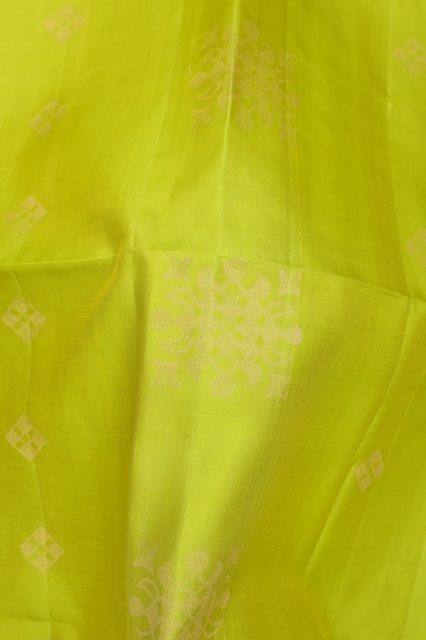 Soft Silk Saree In Lime Green With Zari Buttas