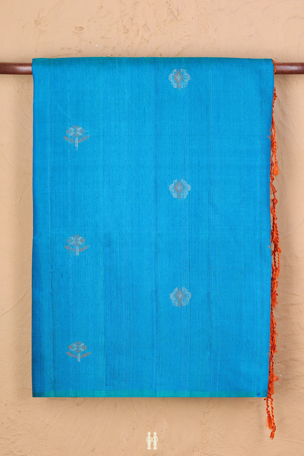 Raw Silk Saree In Blue With Floral Buttas