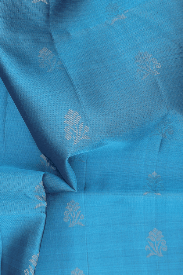 Soft Silk Saree In Blue With Floral Buttas